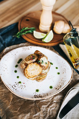 a beautiful serving of potatoes baked in a josper grill with green oil