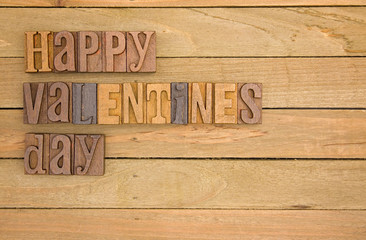 Happy Valentines Day Spelled on a Wooden Background