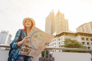 Woman westerner looking at map during city tour in the morning, Westerner tourist conceptual