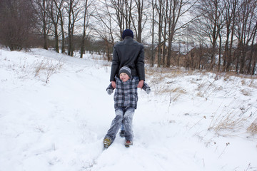 Fototapeta na wymiar pull on the boy snow
