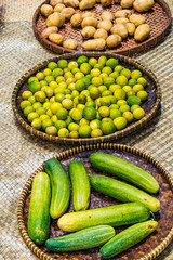 Fresh Cucumbers and Lime in the tray on the wooden table