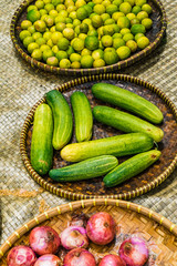 Fresh Cucumbers and Lime in the tray on the wooden table