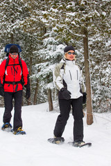 Family snowshoes in snow in Canada