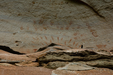 Prehistoric paintings on a cliff. Ancient art painting in Phataem National Park Thailand