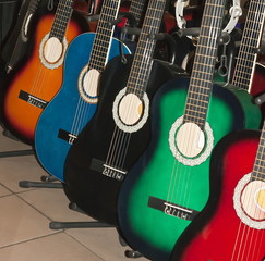 Many colorful acoustic guitars