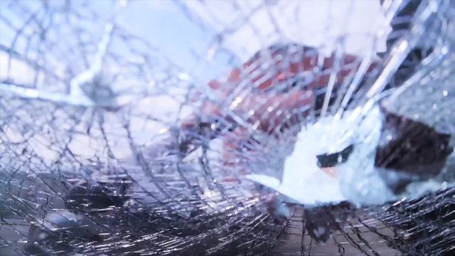 Bandit in a black mask breaks the glass of the machine. Thug smashes the windshield machine gun Kalashnikov