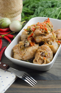 Spicy steamed chicken with herbs. Thai food concept.