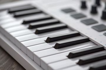 MIDI keyboard with pads and faders.