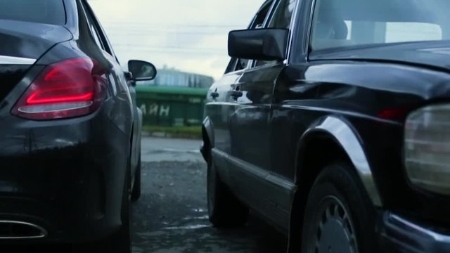 Suitcase was passed from hand to hand cars, the deal was. Suitcase from hand to hand. Case with money transfer for transactions