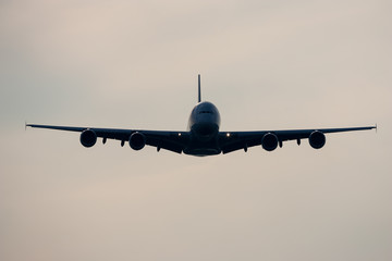 Airbus A380 Jumbo Jet airplane flying in frount of cloudy sky