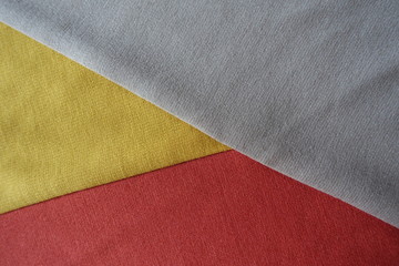Beige, yellow and orange fabrics sewn together