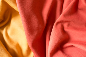 Crumpled yellow and orange simple jersey fabric