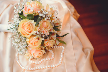 Romantic morning of the bride in detail. Wedding bouquet of white roses 