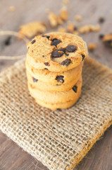 Chocolate chip cookies on dark old wooden table with place for text., freshly baked. Selective Focus with Copy space.