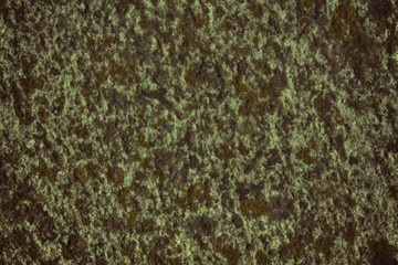 Granite rock closeup background, stone texture, cracked surface