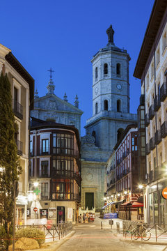 Spain, Castile and Leon, Valladolid, City street with Cathedral of Valladolid in background