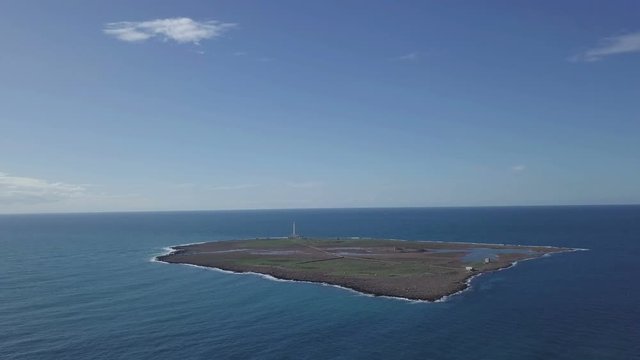 island with lighthouse aerial view from 4k drone
