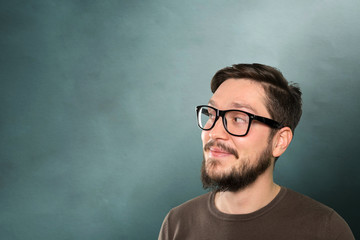 Casual caucasian young man with thoughtful expression