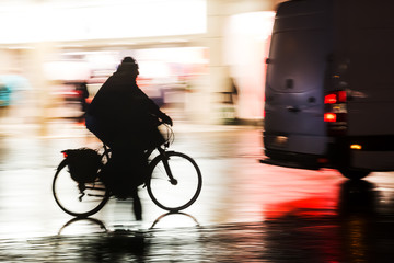 silhouette of a bicycle rider at night