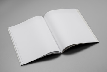 Mock-up magazine, book or catalog on gray table. Blank page or notepad on solid background. Blank...