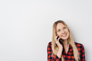 Attractive young woman chatting on her mobile