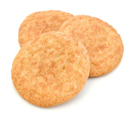 Stack of snickerdoodles over white.