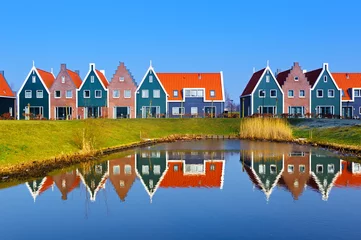 Fotobehang Colored houses of marine  park in Volendam reflected in the water, Netherlands © ptashkan