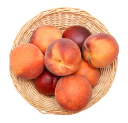 Ripe peach fruit isolated in basket on white background