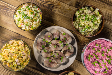 Various festive dishes on wooden table