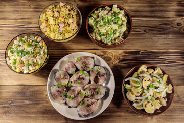 Various festive dishes on wooden table