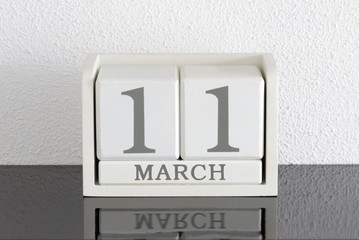 White block calendar present date 11 and month March