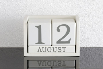 White block calendar present date 12 and month August