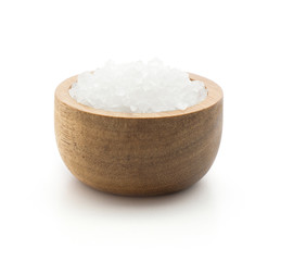 Sea salt in a wood bowl isolated on white background.