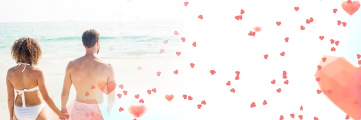 Fototapeta premium Couple by sea with valentine's love transition hearts