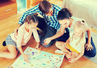 Family playing at board game