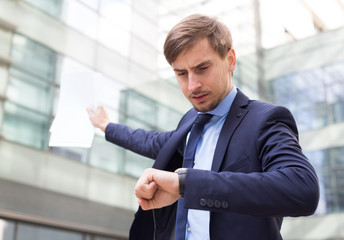 Portrait of busy man in suit rushing