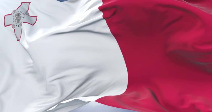 Maltese flag waving at wind with blue sky in slow, loop