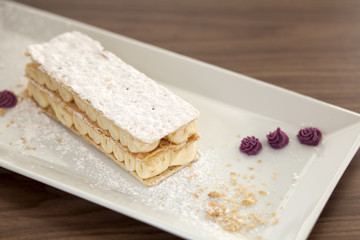 Millefeuille, french pastry on the table at the restaurant