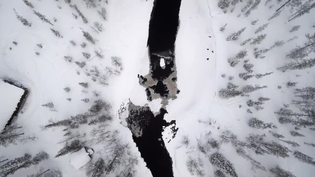 River in Finland forest during winter, aerial