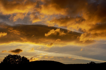 Sunset sunrise with clouds, light rays and other atmospheric effect