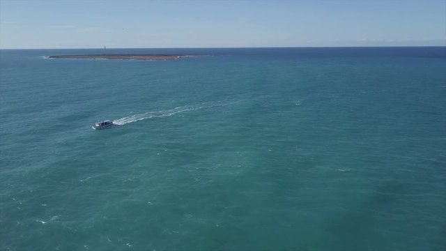 aerial view of a boat sailing in the ocean. drone aerial 4k shot in the mediterranean sea


