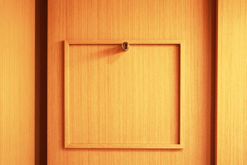An empty wood frame on a wall panel 