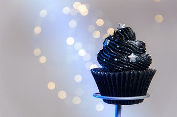 Black galaxy theme cupcake, stars in background 