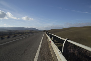 Fototapeta premium Empty road under the blue sky