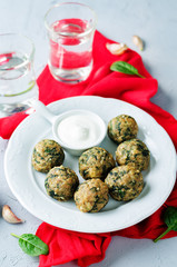 Cheese spinach balls with greek yogurt sauce