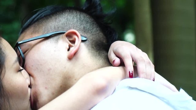 Romantic Young Asian Couple Kissing