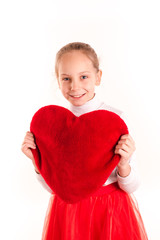 Cute little girl holding red heart isolated