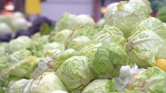 Green fresh cabbage on the counter of the hypermarket. Vegetable department store. Vegetarian food. Food Mall. Close-up