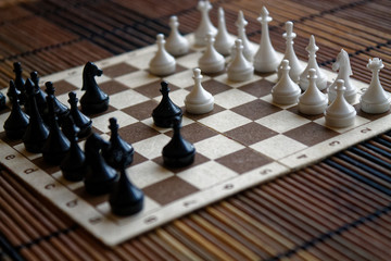 Wooden chess Board and plastic chess pieces, on board © Didi