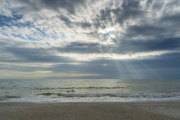 USA, Florida, Spectacular sky and clouds as sunrays shine on the ocean at beach near tampa
